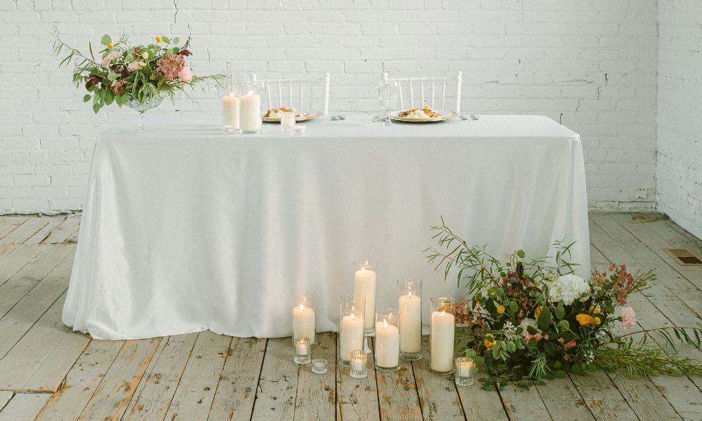 candlelit sweetheart table with floral decor