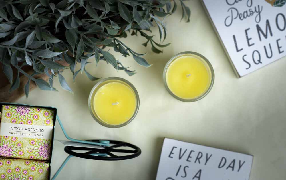 citrus scented votive candles on a table
