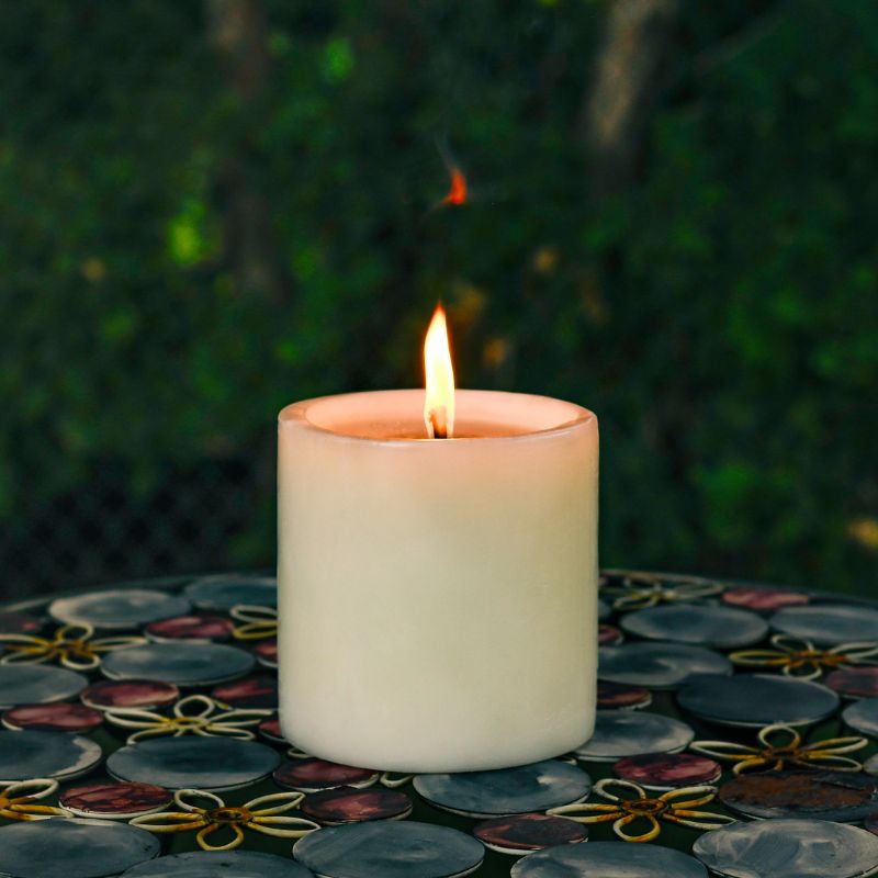 6x6 Outdoor candle on a metal table outside