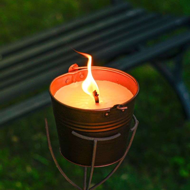 Citronella bucket candle on a stand outside